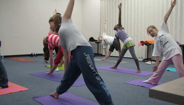 How to involve teens in family yoga sessions